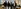 Mehrere Person stehen nebeneinander für ein Gruppenfoto.