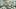 ILIAS Einstein Eine Einsteinbüste steht zwischen zwei Tischen. Um sie herum sind verschiedene Symbole in Gedankenblasen angeordnet.
